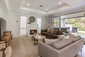 A beautifully styled, open-plan space designed for comfort and connection. The plush seating arrangement invites guests to relax by the gas fireplace, creating a cosy ambiance on cooler evenings.