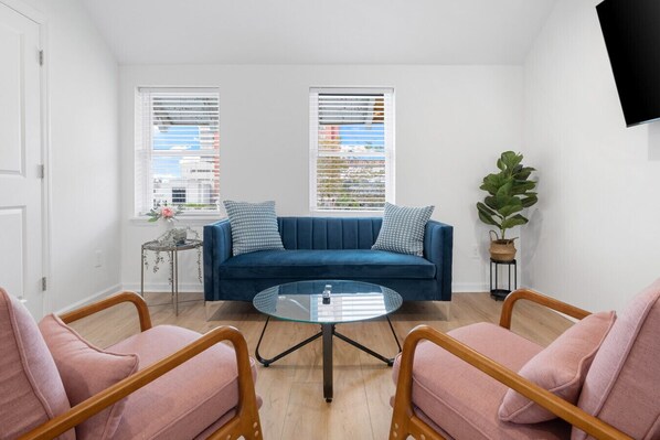 Relax in this beautifully designed sitting area featuring elegant décor, plush seating, and natural light—perfect for conversation or quiet moments!