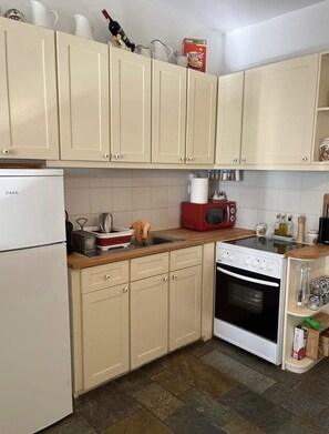 Fully equipped kitchen with all utensils provided. 