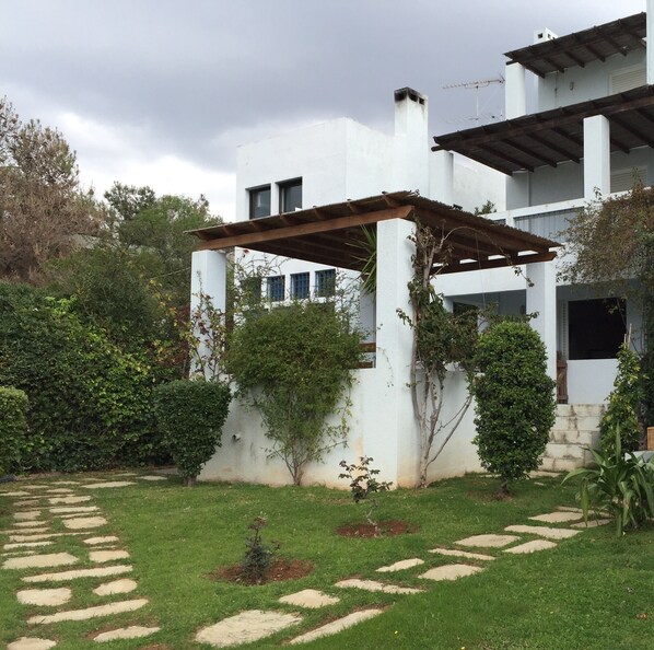 Front of house. Ours is the bottom level with stairs leading into the garden. 