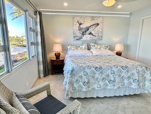 King Bed, wall-mount TV, walk-in closet, nightstand, Air conditioning.
