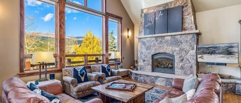 Living room with mountain views and gas fireplace