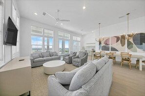 First floor living room, dining, and wet bar
