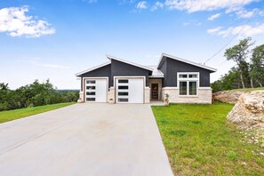 The front of the home features a long driveway which is perfect for boat parking.