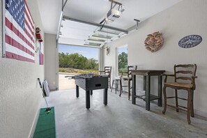 One of the garages has been converted into a game room.