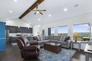 View of the open floor plan with living, dining, and kitchen connected.