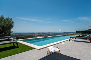 a private swimming pool 11m x 4m with hydro-massage, sun deck area with 8 deck chairs 
