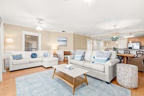 Living area with sleeper sofa, TV and access to balcony