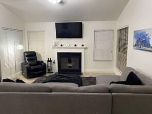 Cozy living room with wood-burning fireplace