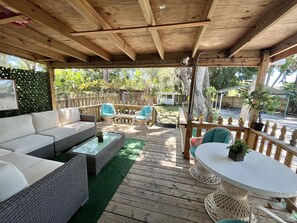A relaxing back porch seating area