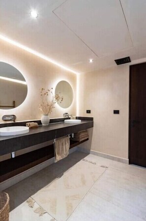 Sleek Spa style master bathroom.