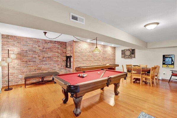 Spacious game room with lots of games. Check listing details for games