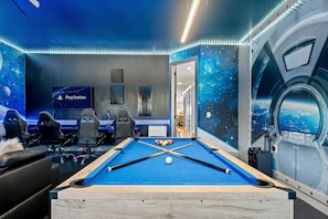 Enjoy family fun in the space-themed game room.