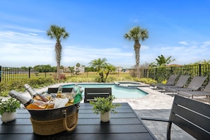Relax and dine by the pool in style, with beautiful views and plenty of space for outdoor fun.