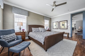 Beautiful spatious bedroom with full bathroom, TV and access to a private balcony.