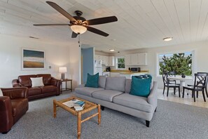 Relax in the large, open-concept Living Area with a Flat Screen TV and plenty of cozy furniture.