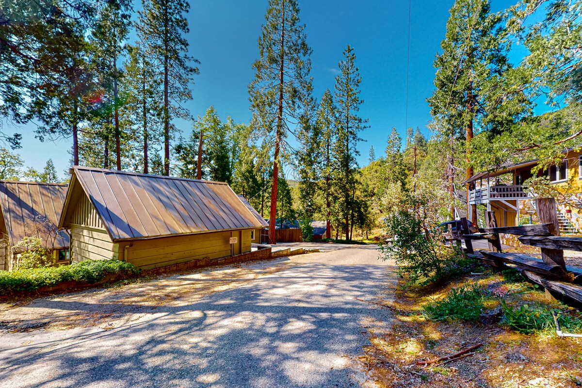 Updated home with lake views, spacious deck, grill, fireplace & updated interior