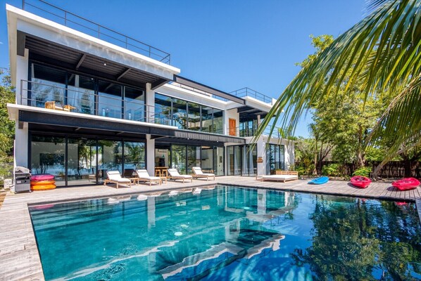 Balam pool, pool deck, and saltwater kayaks