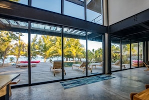 Living room sliding door to the pool deck and beach