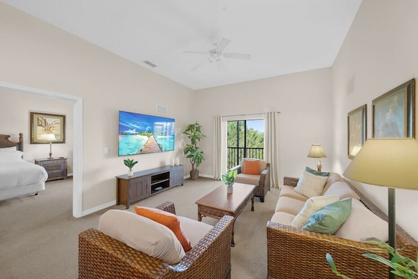Living Room with 75" Smart TV#Disney #Parks #kingdom #springs #CaribeCove #Apartment #Vacation #Rental #waterpark #Kissimmee #Orlando #universal #citywalk