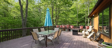 Oversized deck with seating, table and BBQ grill