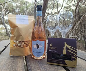 To help you unwind, enjoy a bottle of KI wine and treats!