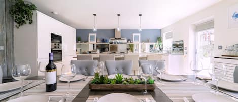 Ground floor: Dining table for eight and well-appointed kitchen