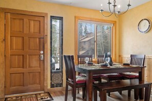 Enjoying dining as a group at the dining room table that has seating for 6.