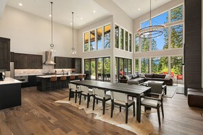 7 Pines Retreat: - Seating for 10 to 12 around the large dining table with additional seating for 6 at the island bar.