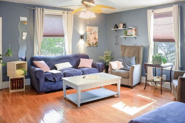 The living room is very spacious and offers a lot of natural light