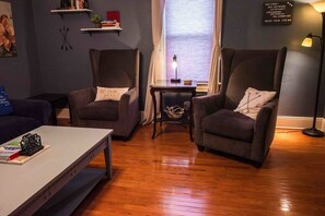 The living room can also be a bit moodier when the blinds are drawn. It also features blackout curtains to eliminate the majority of the exterior light.