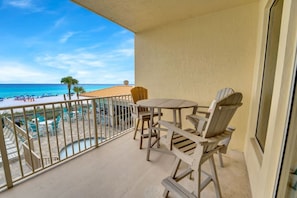 Enjoy the views! Porch overlooks the pool, hot tub, bar and GULF of Mexico.