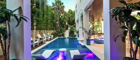 Twilight - Covered Pool Area - Resort Style Pool - Featuring a Waterslide, Spa,  (2)Rain Curtains and (2)Splash/Sunshelfs