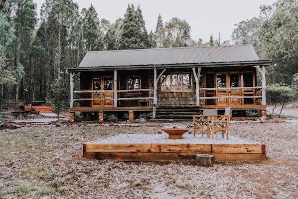 A cosy wooden cabin with a large front veranda is the ultimate Australian getaway.