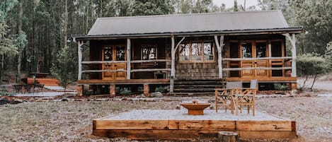 A cosy wooden cabin with a large front veranda is the ultimate Australian getaway.