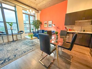 Spacious living room with a lot of natural light and large windows.
