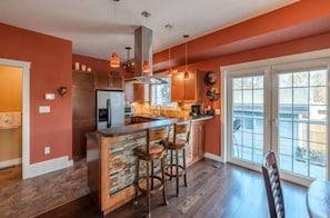 Kitchen & bar area. Fully stocked with all utensils & spices for any cook!
