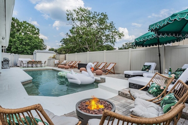 Welcome to our backyard! A heated pool, BBQ, outdoor dining space and lots of spots to lounge.