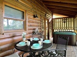 You'll absolutely love the screened porch that looks out to the woods