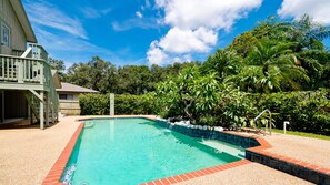 A private swimming pool with outdoor shower in your own garden oasis.