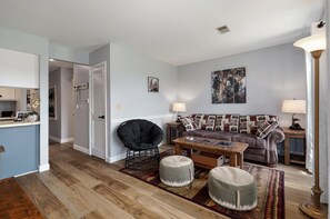 Relax in the living room equipped with a queen size sleeper sofa and 55'' TV.