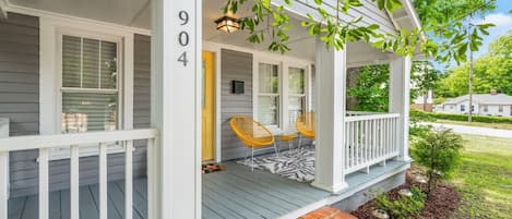Front Porch with beautiful yellow decor