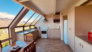 Kitchen with dining nook on right