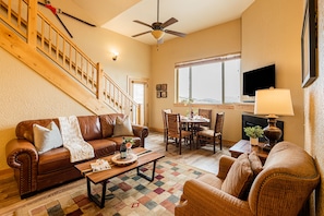 Main Level Living Room with a Full-Size Sleeper Sofa, Smart TV and Gas Fireplace