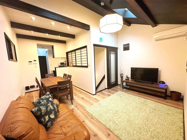 A spacious living room that can accommodate large groups of people for meals and parties!