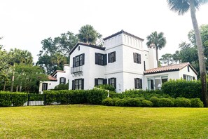 Corner view of the home, highlighting the Addison Mizner architecture. 