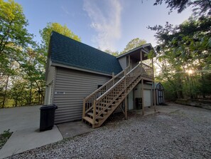 Huge Garage on 1st floor and Cottage Entrance is at the top of the stairs.