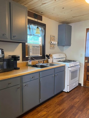 Kitchen has brand new appliances, microwave and single cup keurig machine 
