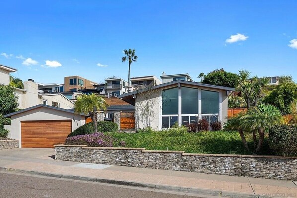 Exterior of mid-century modern house on a quiet street in Bay Park, San Diego