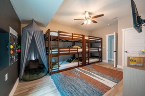 Discover the joy of sleepovers and shared adventures with two triple bunk beds, offering ample space for laughter and late-night stories. The play tent provides a whimsical retreat for little ones to create their own magical world. Engage in hours of fun